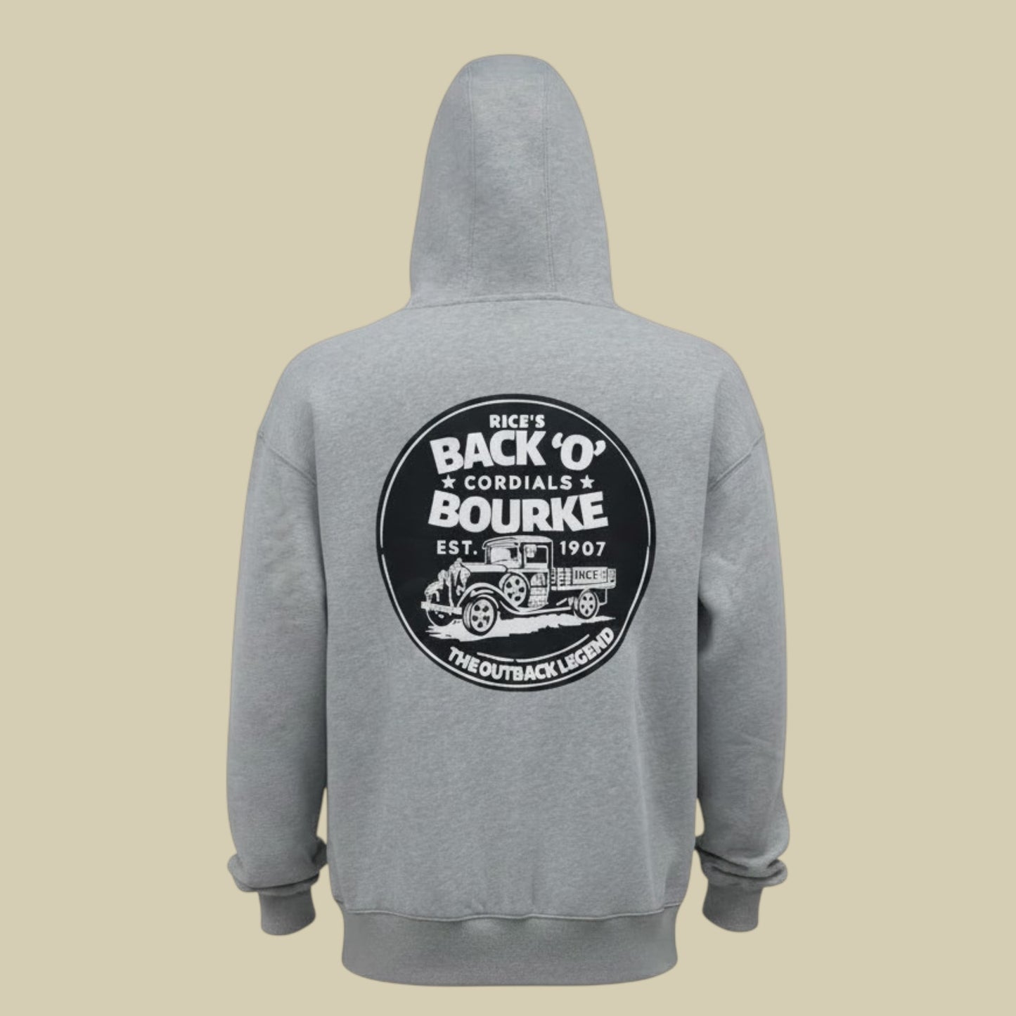 A heather gray pullover hoodie shown from the back, featuring a large circular black and white graphic print on the back with vintage truck artwork and the text 'Rice's Back 'O' Bourke Cordials '.